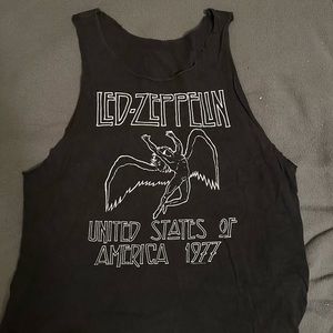 Sleeveless and collarless large shirt